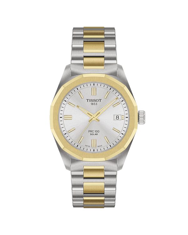 Γυναικείο ρολόι Tissot PRC 100 Solar T151.822.22.031.00 με κάσα 34mm από ανοξείδωτο ατσάλι 316L με κίτρινη PVD επίστρωση, γκρι/χρυσό μπρασελέ, ασημί καντράν, ελβετικό Lightmaster Solar Quartz μηχανισμό, ημερομηνία, ένδειξη End of Energy, αντιχαρακτικό ζαφείρι και αδιαβροχοποίηση 10 ATM / 100 μέτρα.