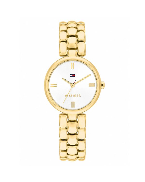 Γυναικείο ρολόι Tommy Hilfiger Annie 1782928 με χρυσή επιχρυσωμένη κάσα 26mm και μπρασελέ από ανοξείδωτο ατσάλι, φωτεινό λευκό/ασημί sunray καντράν, Quartz μηχανισμό, ορυκτό κρύσταλλο ειδικής σκλήρυνσης, κούμπωμα ασφαλείας και αδιαβροχοποίηση 3 ATM / 30 μέτρα.